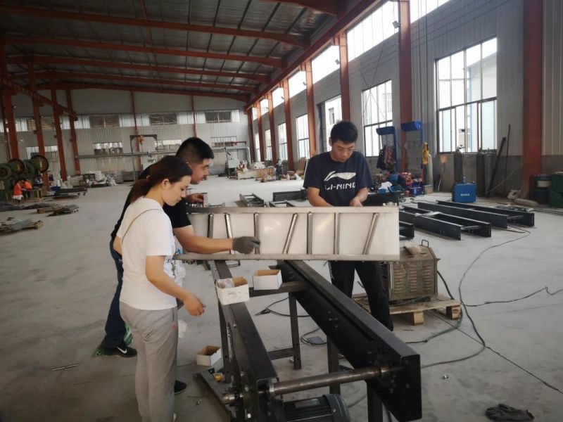 China Factory High Quality Selling Screw Turn Telescopic Belt Steel Roller Conveyor